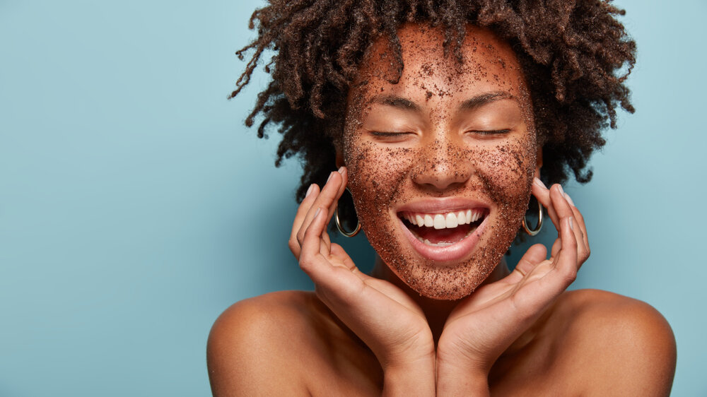 Woman exfoliating with sugar scrub